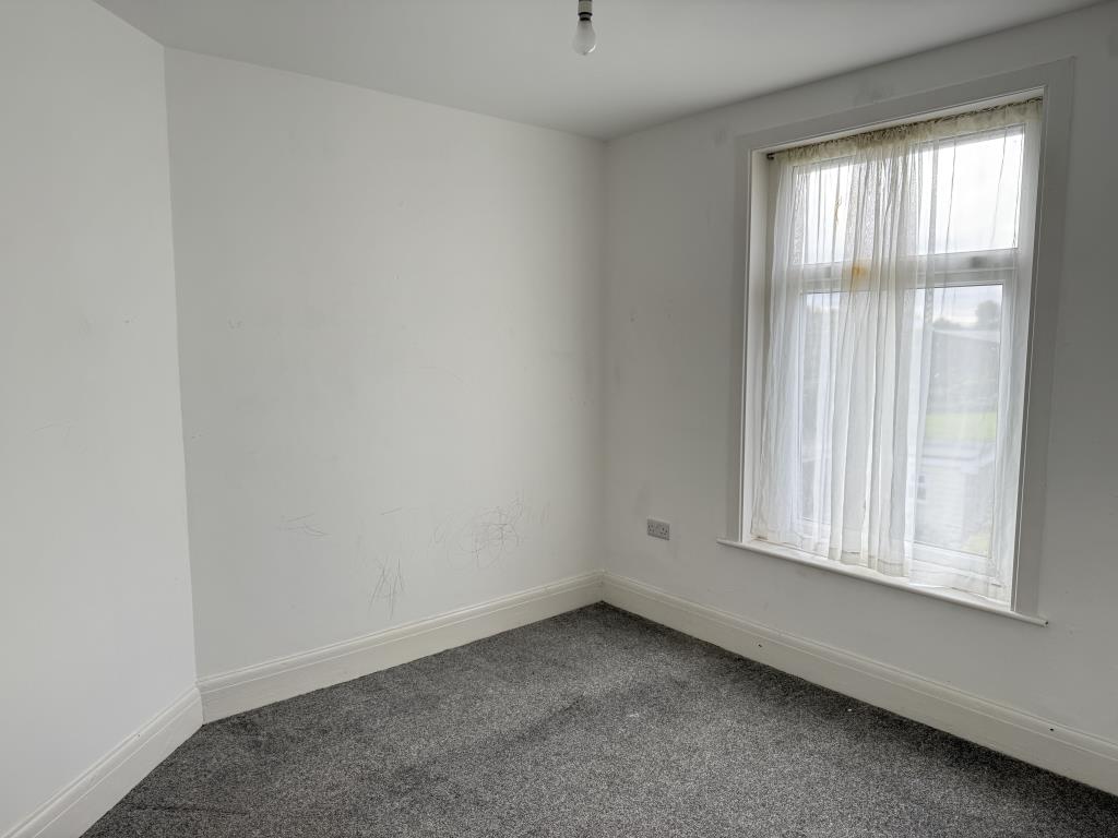 Lot: 24 - TWO-BEDROOM SEMI-DETACHED HOUSE - Bedroom two with white walls and grey carpet